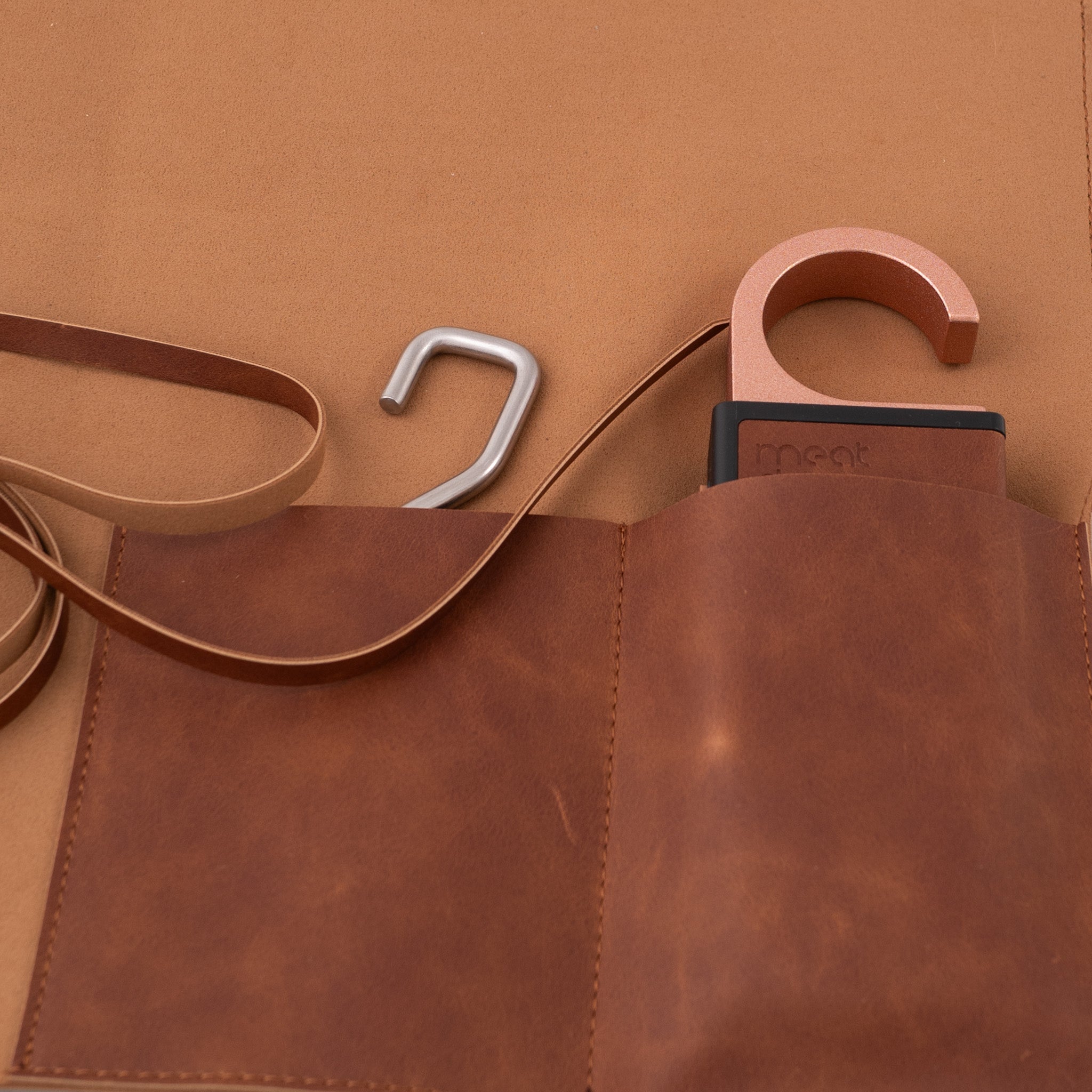 Brown leather tool roll with strap and Meatdryer smart hook