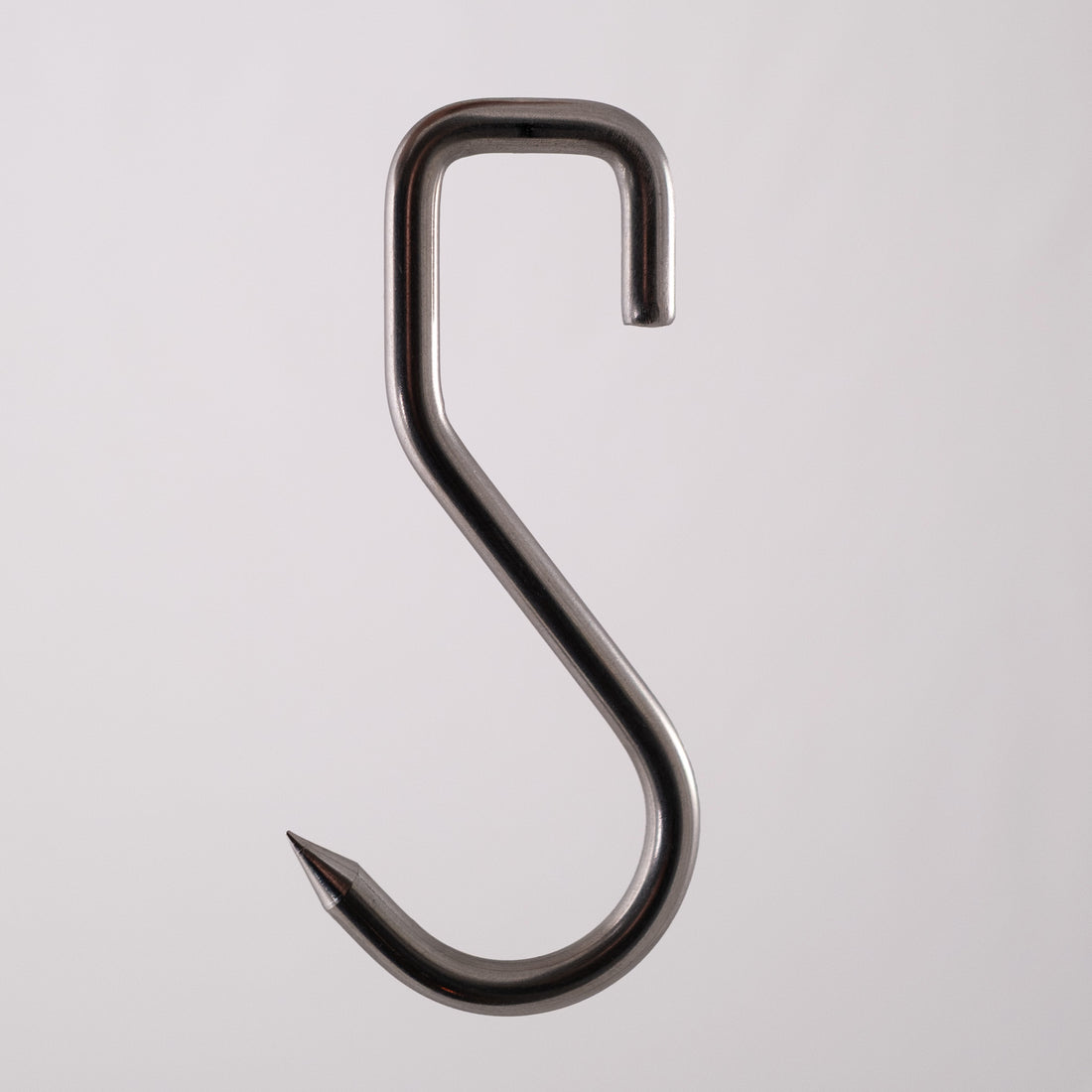Food safe sharp stainless steel meat hook on a gray background
